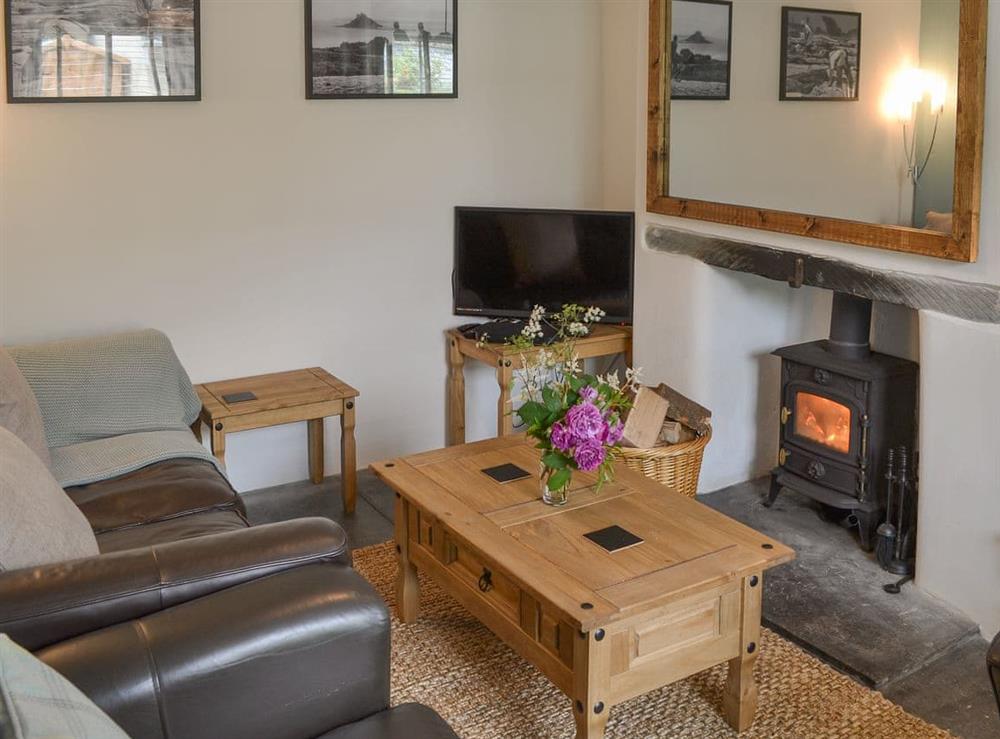 Charming living room with cosy wood burner at Sunnyside in Trewalder, near Wadebridge, Cornwall