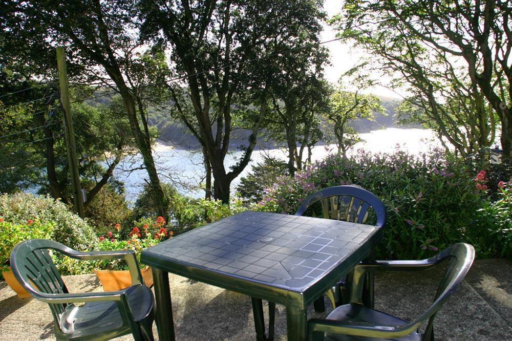 Terrace area with views of the estuary through the trees at Sunrise, 8 Melbury in Devon Road, Salcombe