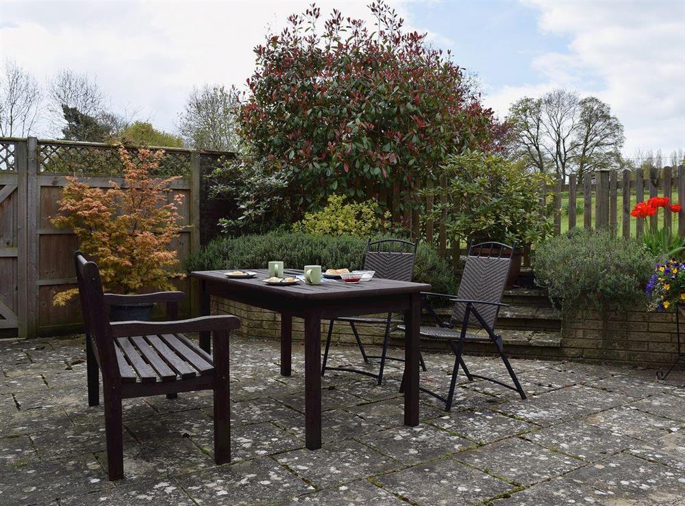Comfortable table and chairs for outdoor entertaining at Sunrise in Kings Coughton, near Alcester, Warwickshire