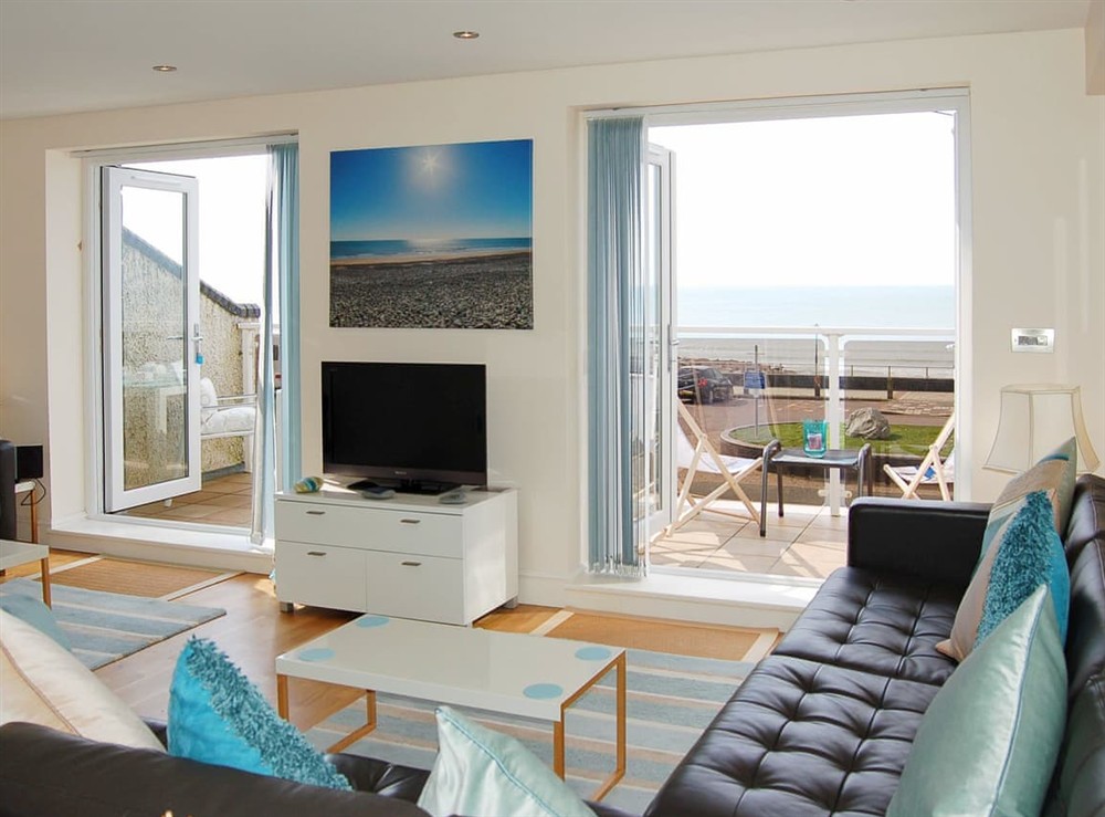 Living area at Sunset Bay Beach House in Tywyn, Gwynedd