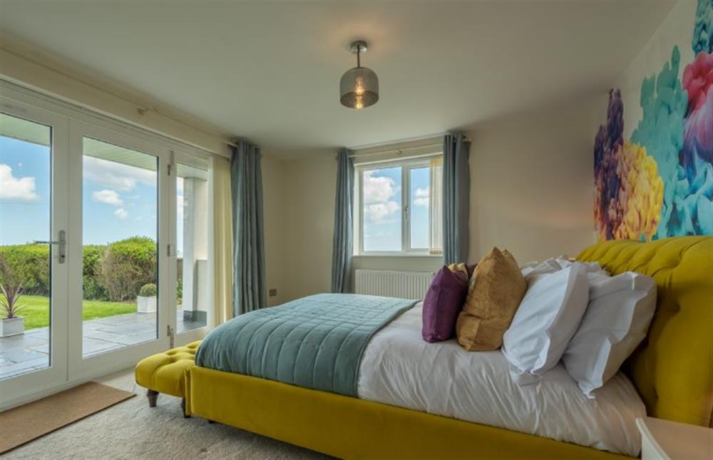 Ground floor: The master bedroom has a side window view of the sea at Sunset, Overstrand near Cromer