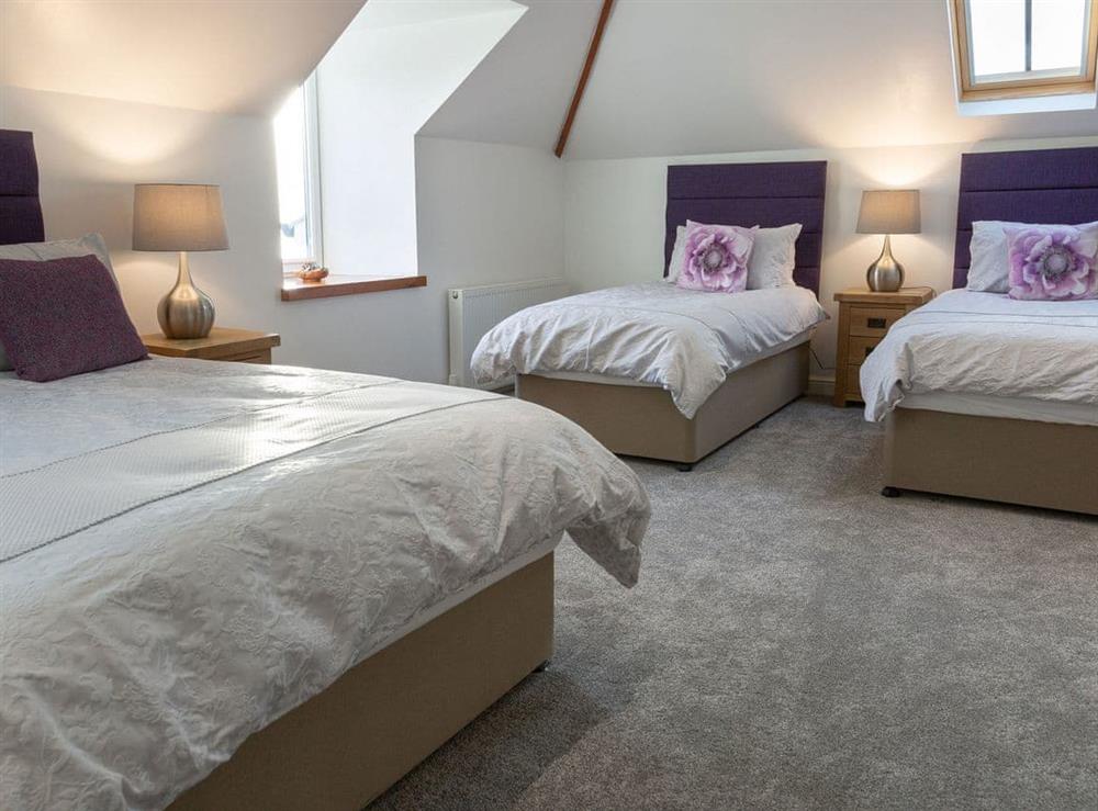Family bedroom with a double and twin beds at Sunset View in Port Lamont, near Dunoon, Argyll and Bute, Scotland
