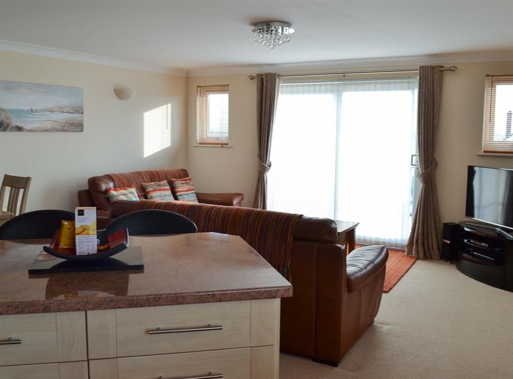 Open plan living space with balcony (photo 2) at Sunsets@Spinnakers in Newquay, Cornwall