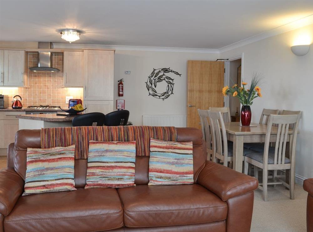 Open plan living space with balcony (photo 3) at Sunsets@Spinnakers in Newquay, Cornwall