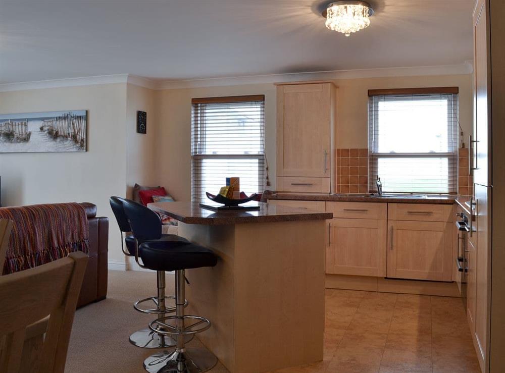 Open plan living space with balcony (photo 6) at Sunsets@Spinnakers in Newquay, Cornwall