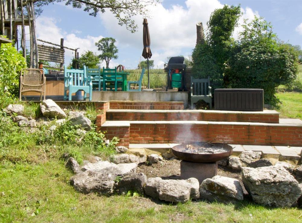 Hot tub and barbecue area at Sunwood House in Ditcham, near Petersfield, Hampshire