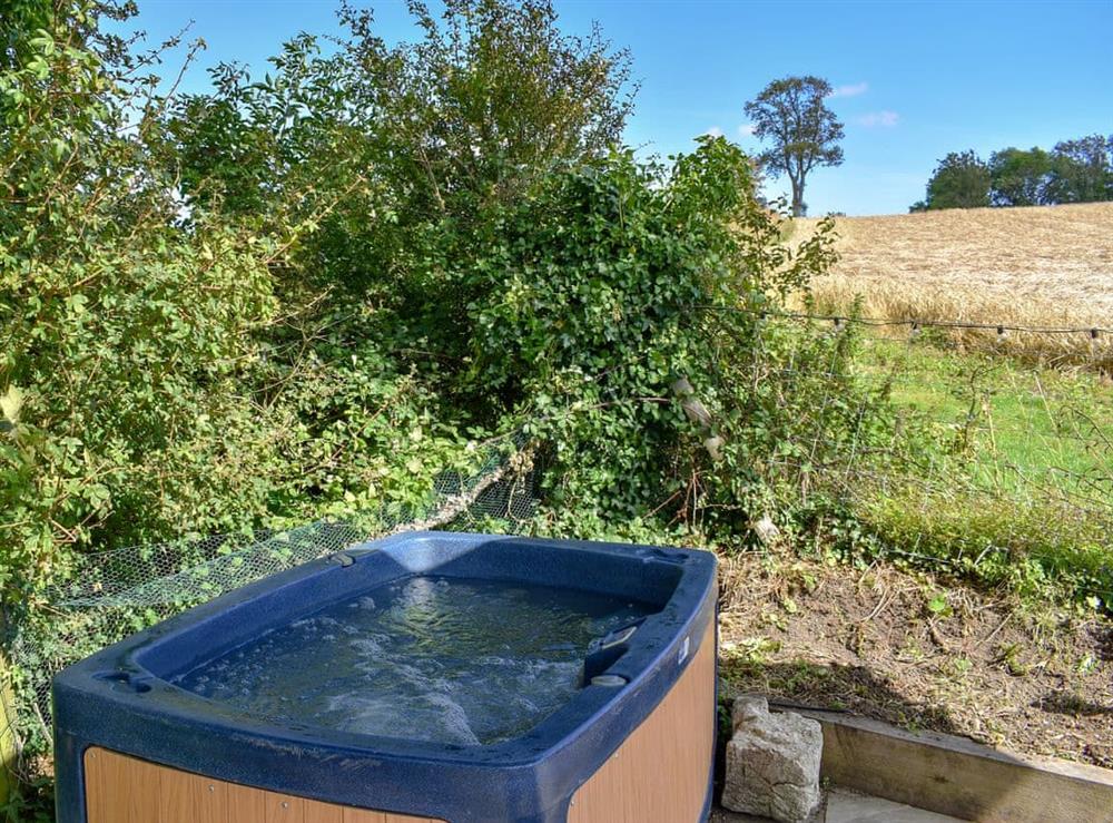 Relax in the private hot tub at Sunwood House in Ditcham, near Petersfield, Hampshire