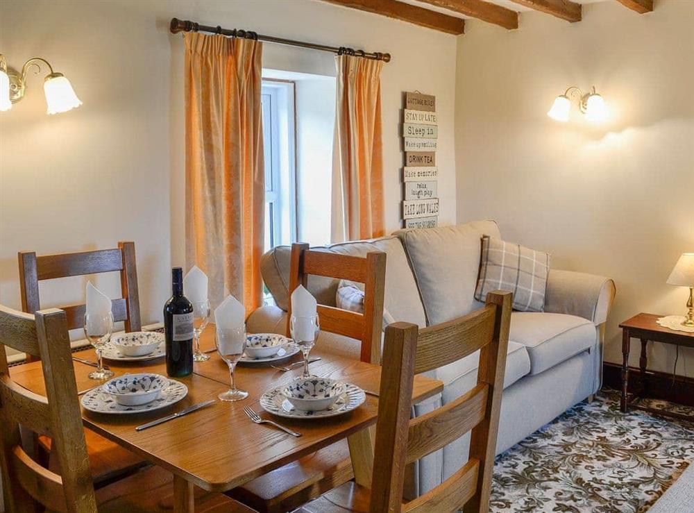 Cosy and welcoming dining area at Swaledale Cottage in Caldbeck, near Keswick, Cumbria