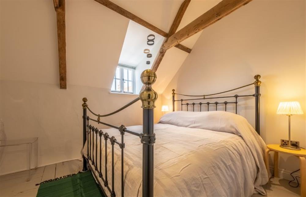 Master bedroom with 5’ king-size bed at Swallow Cottage, Binham near Fakenham