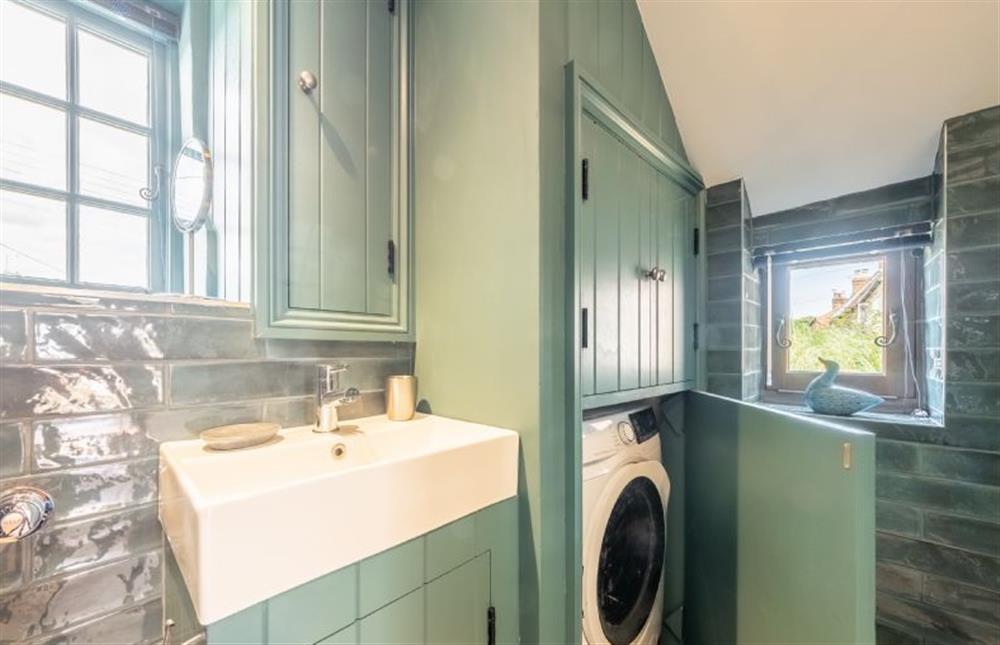 Shower room with laundry facilities at Swallow Cottage, Binham near Fakenham