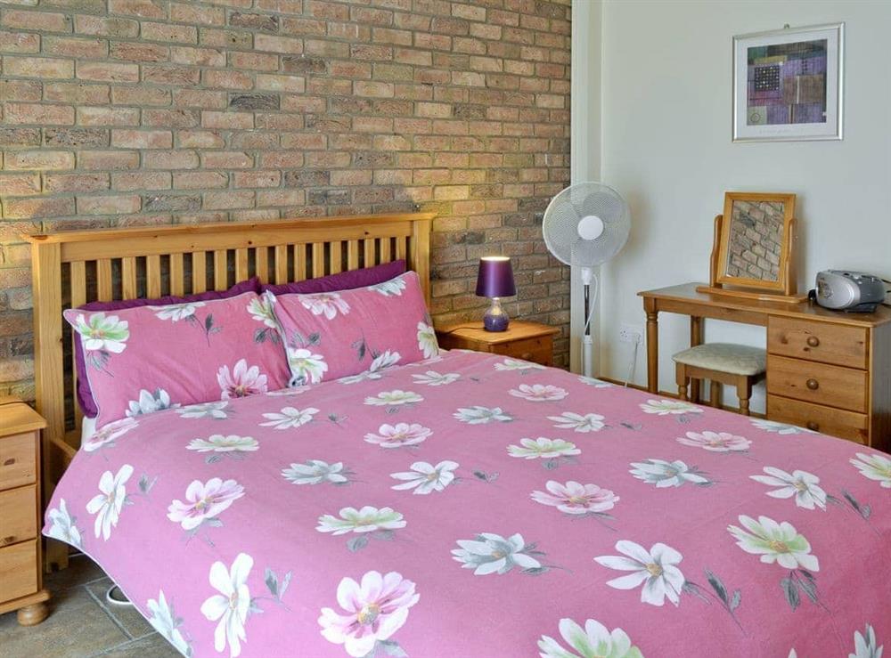 Comfortable double bedroom at Swallow Cottage in Muston, Filey, North Yorkshire
