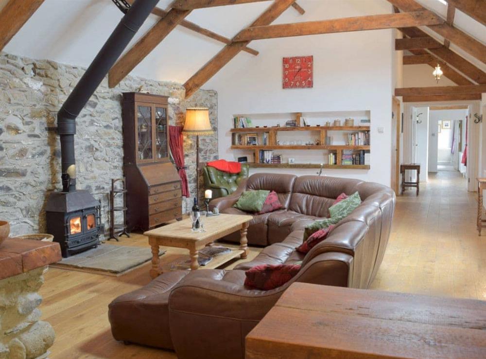 Delightful living area with wood bunrer at Swallow Lodge in Mathry, near St Davids, Dyfed