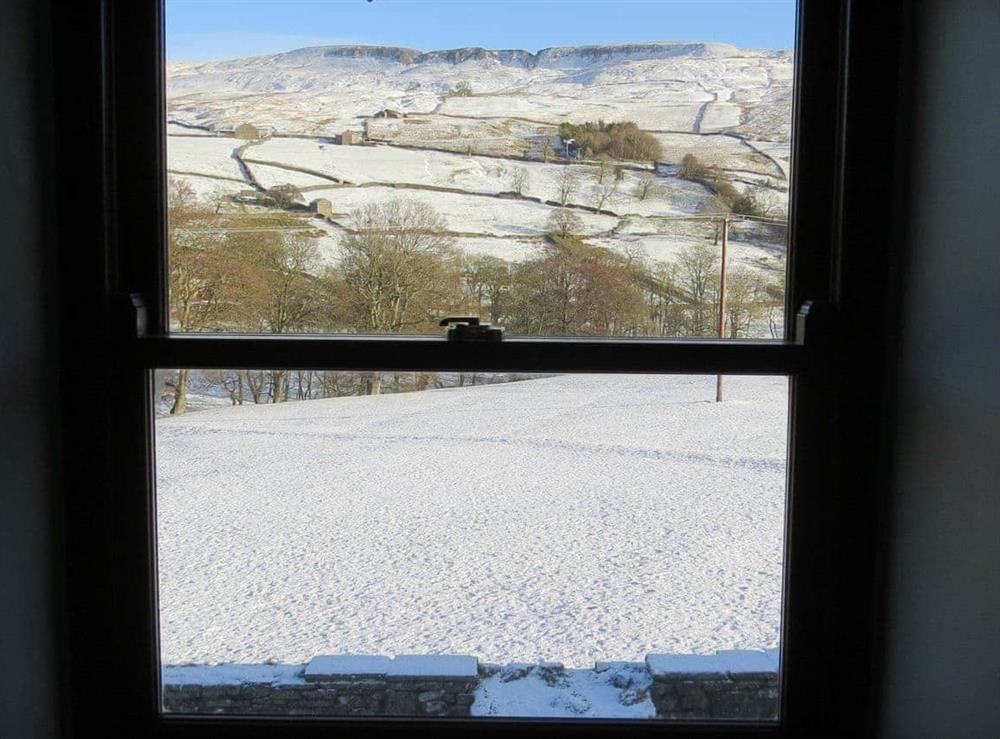Winter view from inside the cottage at Swallowholm in Arkengarthdale, North Yorks., Surrey