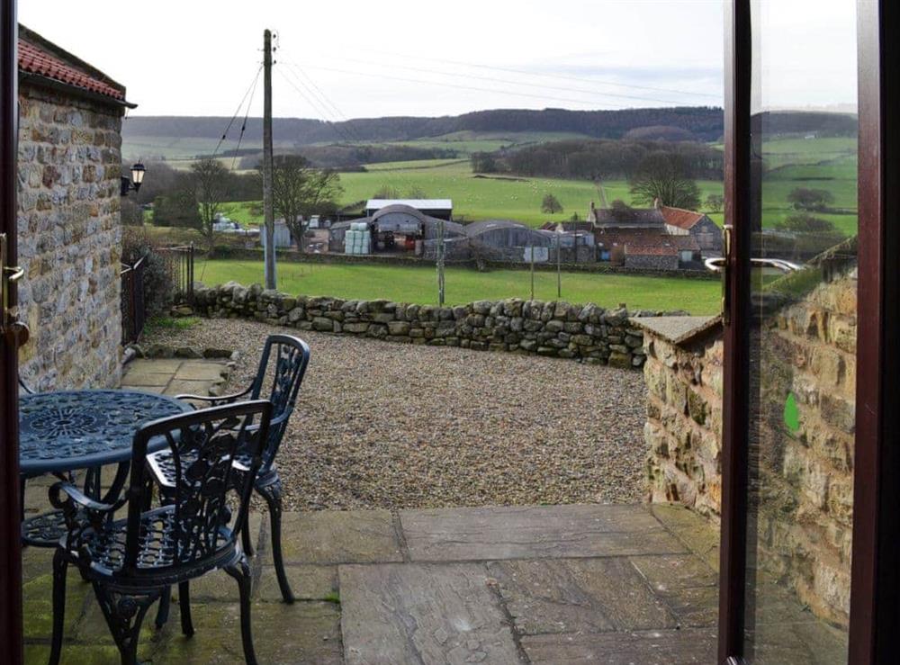 Patio with seating area and fine view at Swallows Nest in Harwood Dale, Scarborough, North Yorkshire