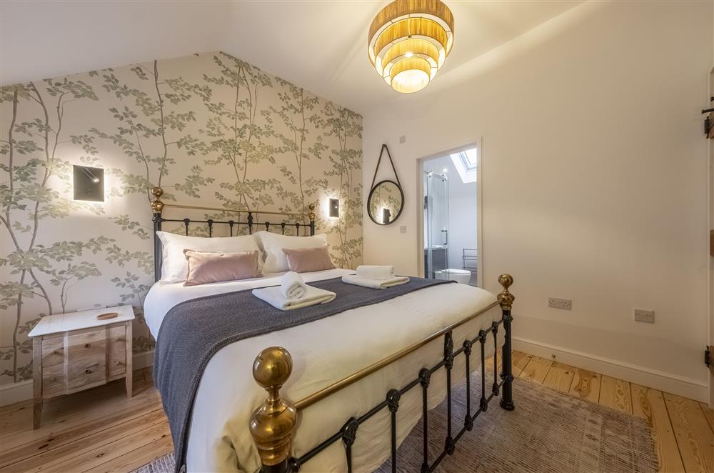 The principle bedroom boasts an en-suite shower room at Swallows Nest, near Buxton