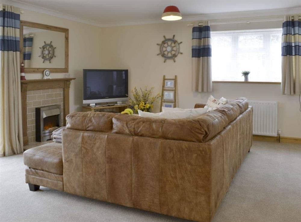 Cosy seating area within spacious open-plan living space at Swallows Rest in East Taphouse, near Liskeard, Cornwall