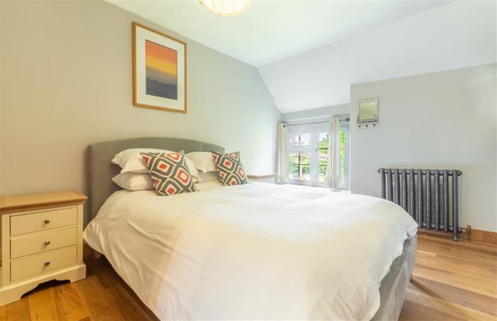 Swan Cottage: First floor bedroom 3  with a king sized bed at Swan Cottage, South Creake near Fakenham