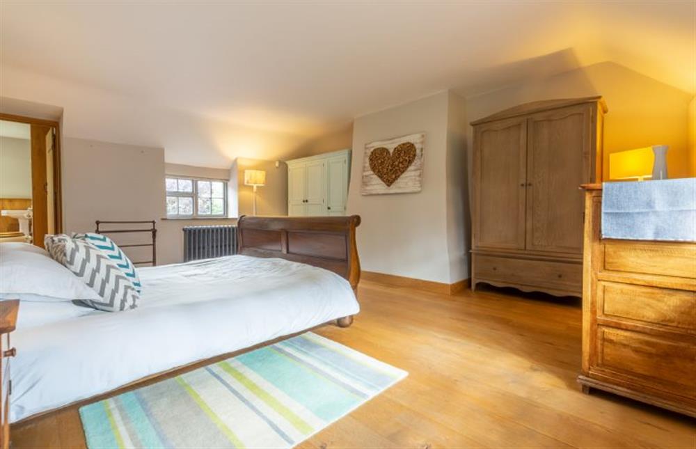Swan Cottage: First floor Master bedroom with a super-king sized bed at Swan Cottage, South Creake near Fakenham