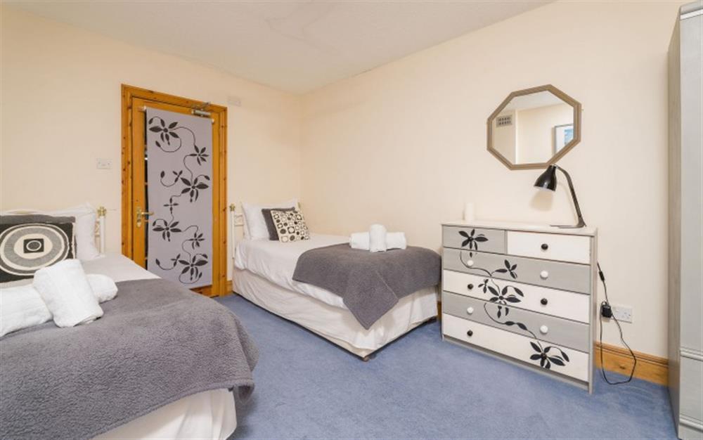 The twin bedroom adjacent to the pool. at Swan Haven in Torcross
