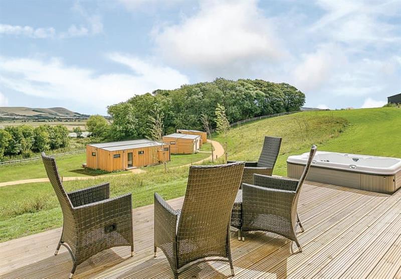 Decked area outside Hill View at Swanborough Lakes Lodges in Lewes, East Sussex
