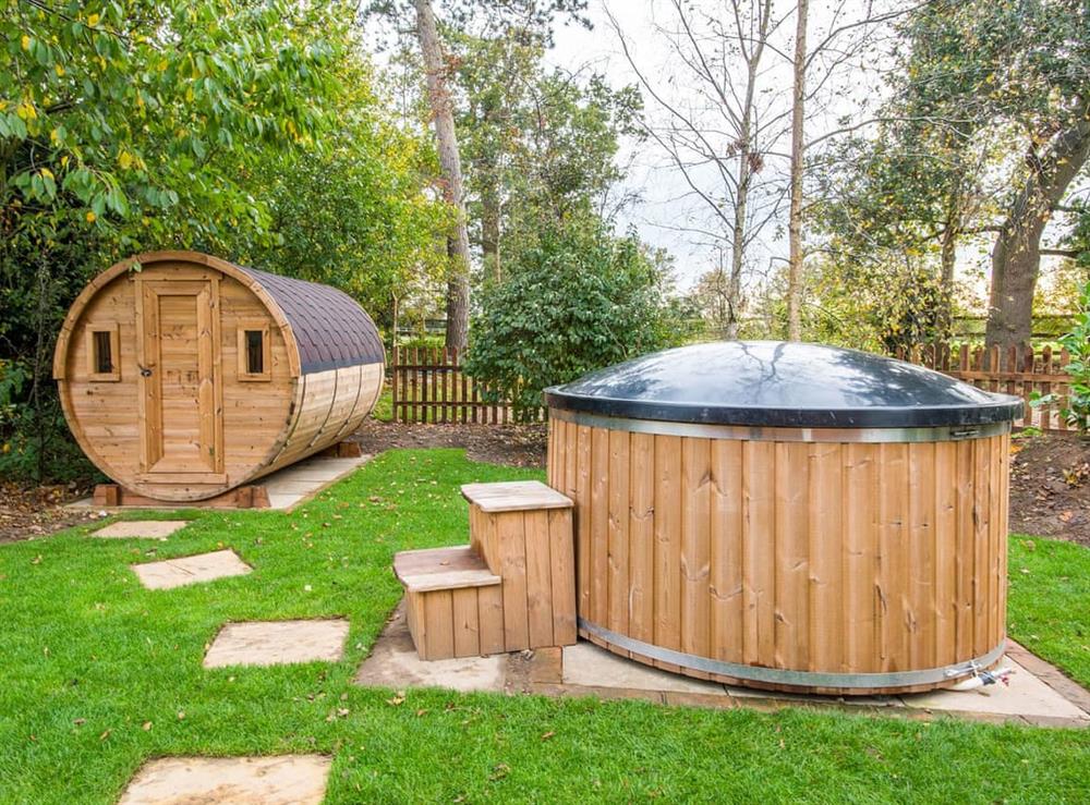 Private hot tub and sauna at Cowslip Cottage, 