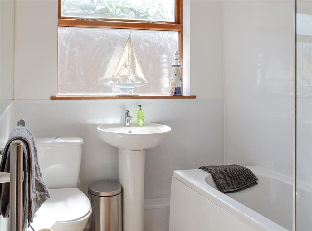 Family bathroom with shower over bath at Sweet Hope in St Cyrus, near Montrose, Aberdeenshire