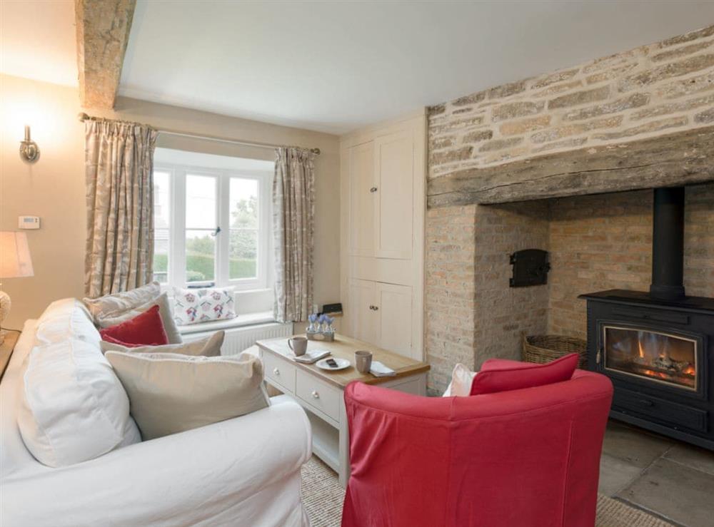 Pretty, comfortable and cosy living/ dining room at Sweet Pea Cottage in Kingston, near Corfe Castle, Dorset