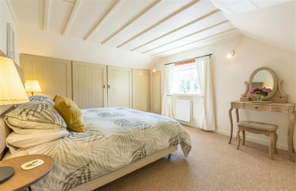 First floor:  Master bedroom with king size zip and link bed at Swift Cottage, Dersingham near Kings Lynn
