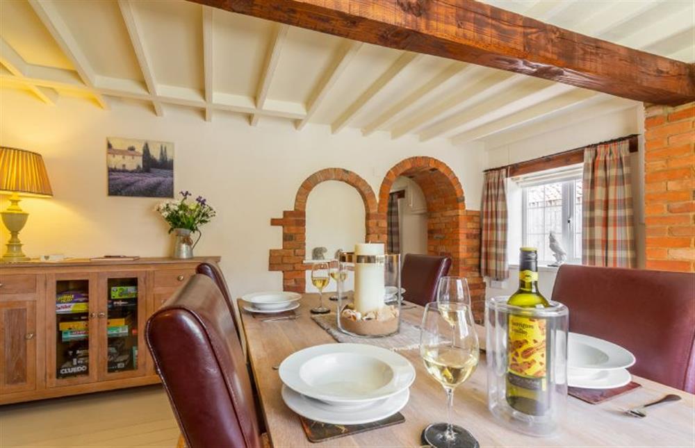 Ground floor:  Dining room with table with seating for four at Swift Cottage, Dersingham near Kings Lynn