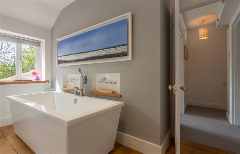 First floor:  Master suite with feature freestanding bath at Sybil Cottage, Holme-next-the-Sea near Hunstanton