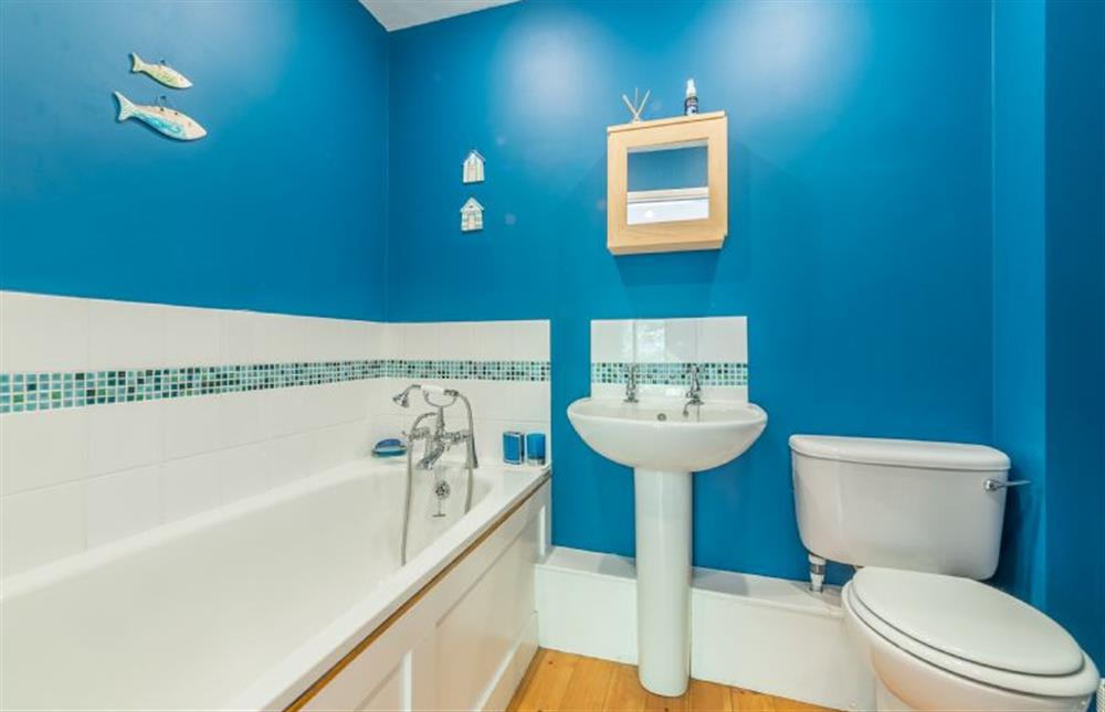 Ground floor: Bathroom with bath with hand held shower (photo 2) at Sybil Cottage, Holme-next-the-Sea near Hunstanton