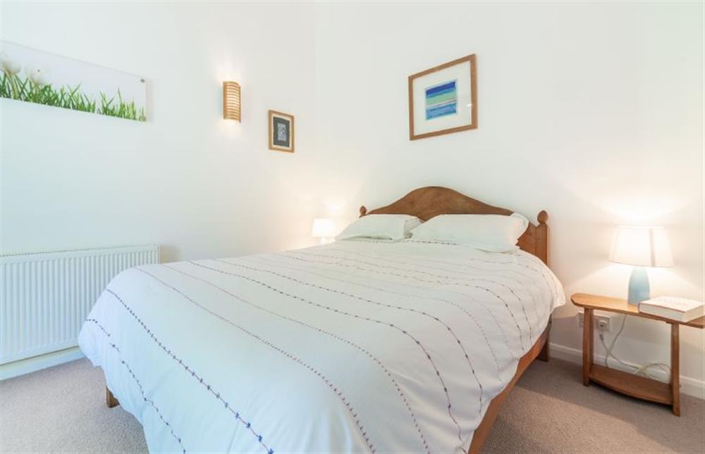 Ground floor: Bedroom two with King-size bed at Sybil Cottage, Holme-next-the-Sea near Hunstanton