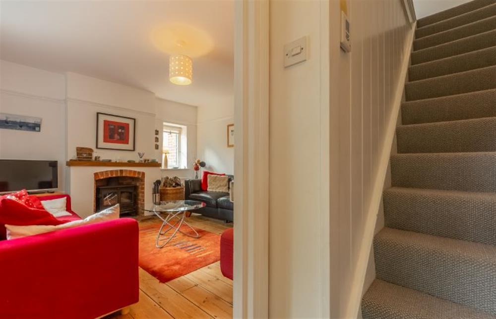Ground floor:  Sitting room with stairs to first floor (photo 2) at Sybil Cottage, Holme-next-the-Sea near Hunstanton