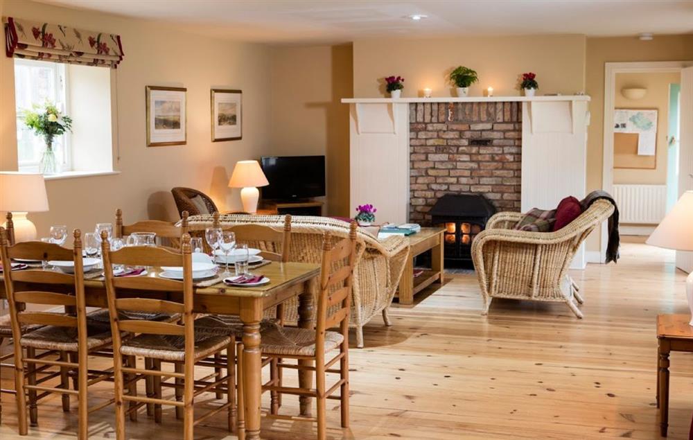 Open plan sitting and dining area at Sycamore Cottage, Belle Isle Estate