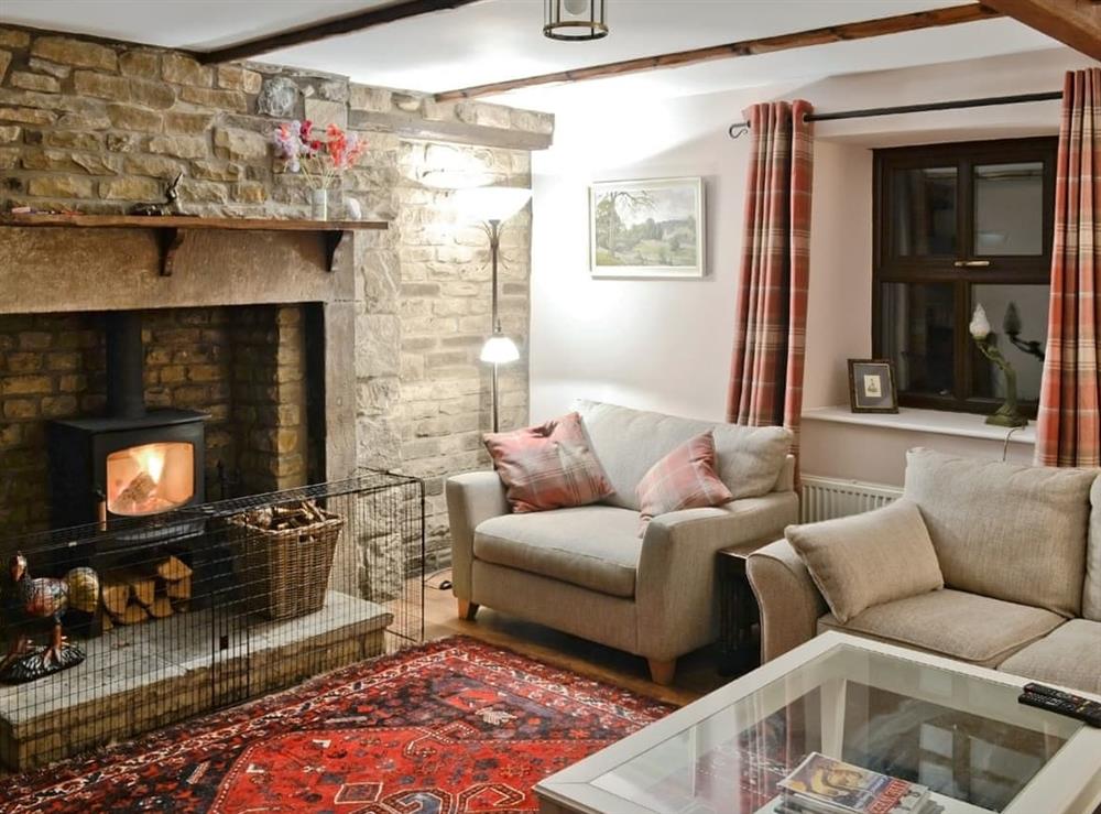 Cosy country living room with beamed ceiling and woodburner (photo 2) at Sycamore Cottage in Skipton, North Yorkshire