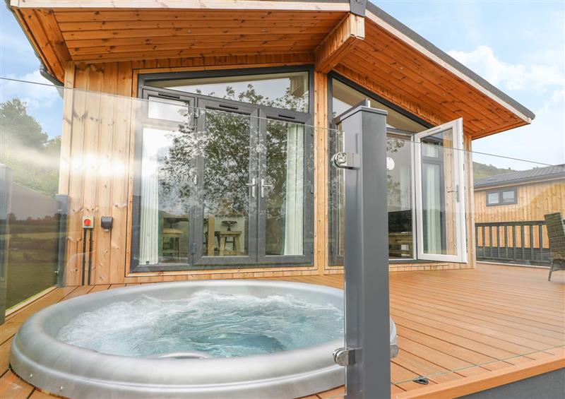 Relax in the hot tub at Sycamore Lodge, Llangurig