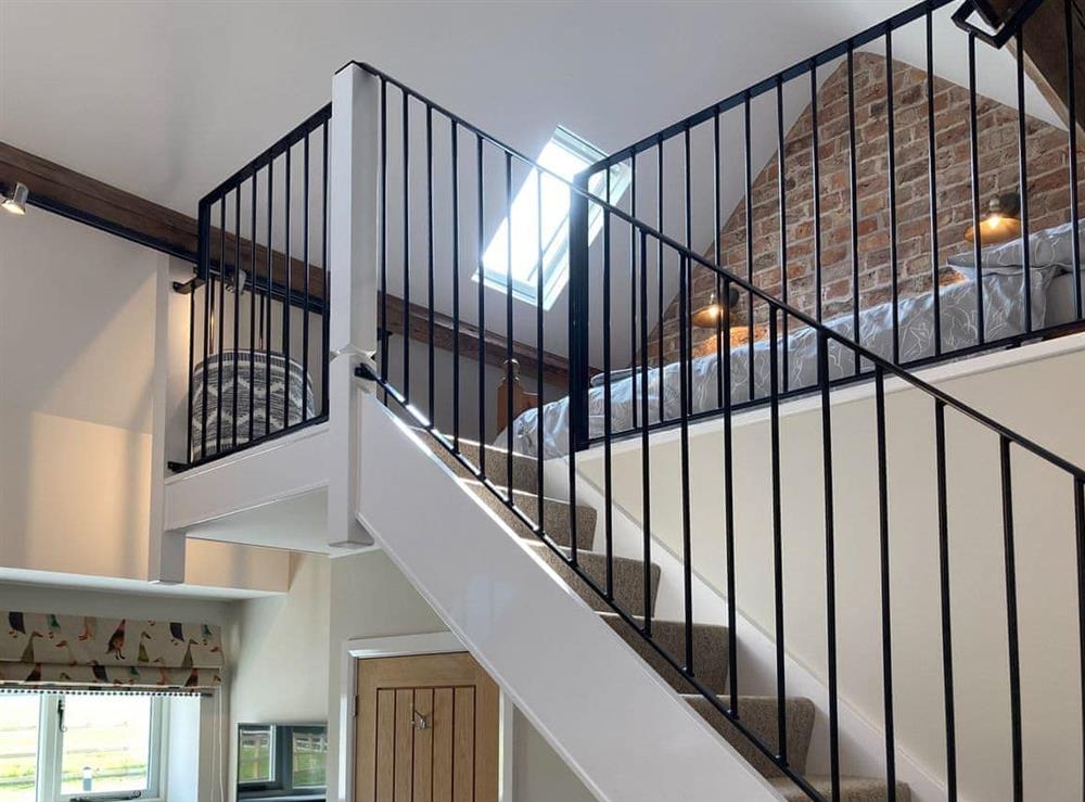 access stairs from double bedroom to mezzanine at Tadpole Mews at Frog Hall in Tilston, Cheshire
