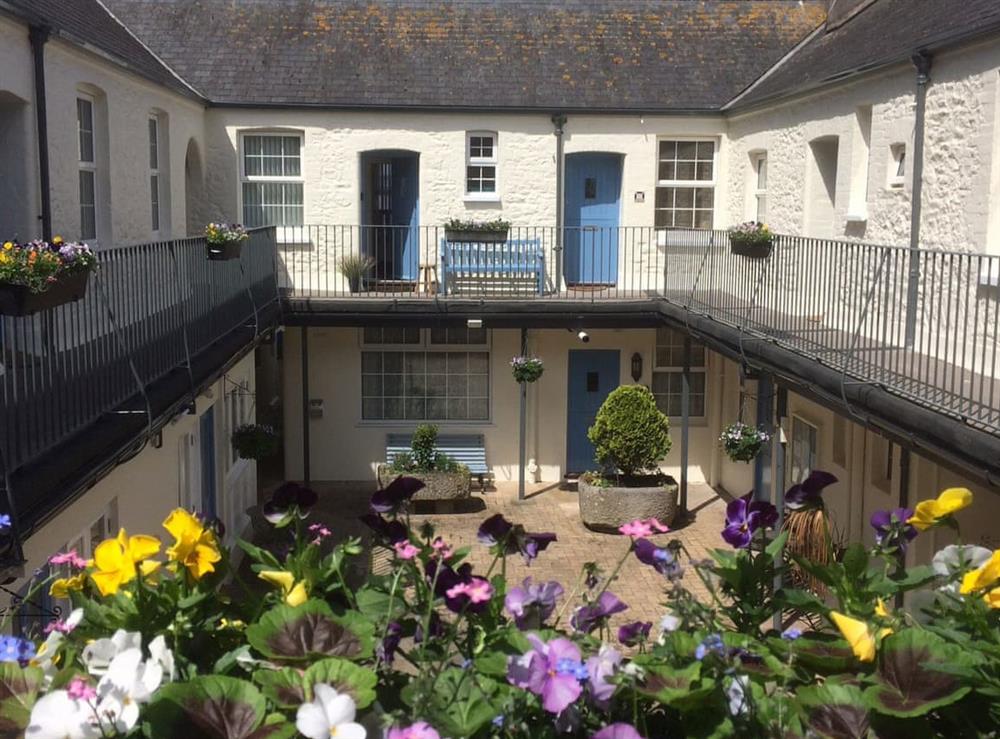 Pretty courtyard and balcony at Tamarisk in Torquay, Devon