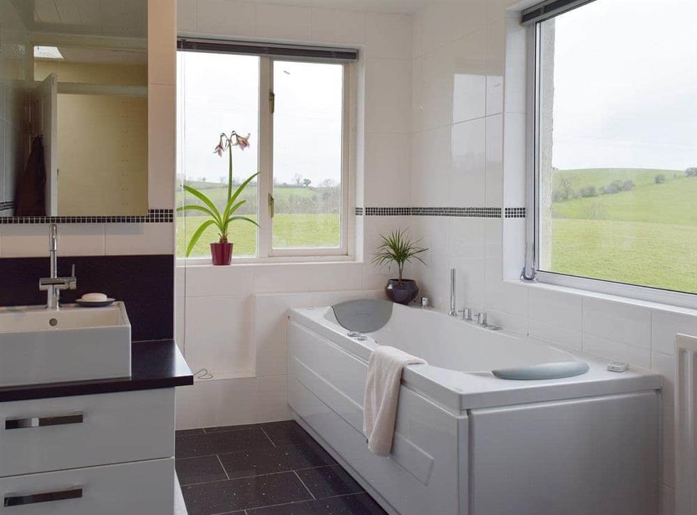 The second bathroom also has a Jacuzzi bath and has windows on two aspects giving great views over the countryside at Tan Y Castell in Llanmill, near Narberth, Dyfed