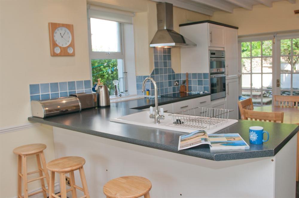 Modern kitchen with breakfast table at Tarqua in Hope Cove, Nr Kingsbridge