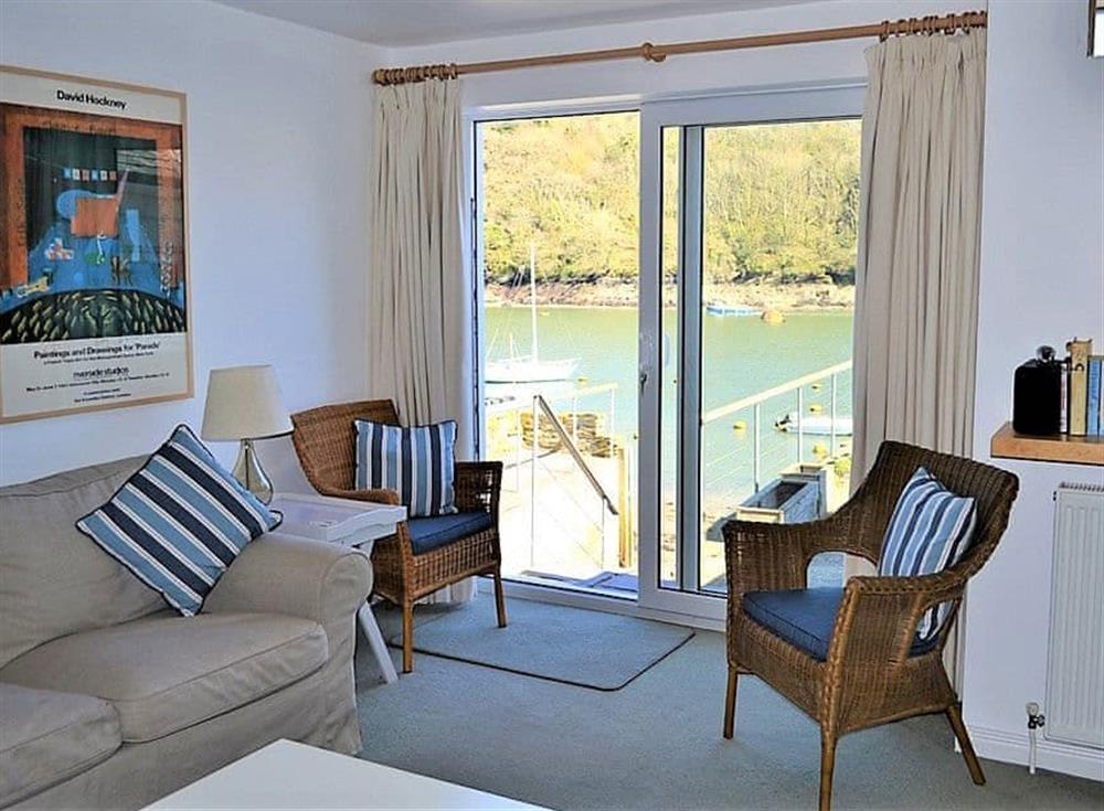 Living area with fantastic views of the river from the patio at Tarquins in Fowey, Cornwall