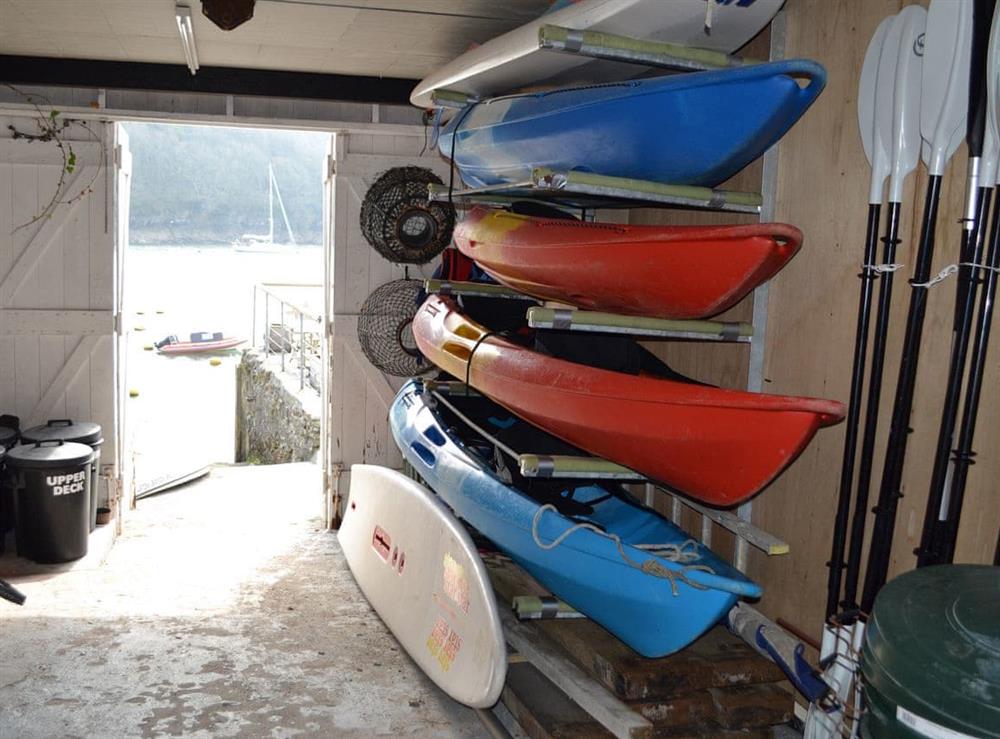 The boathouse for storage of wet gear, outboard motors and windsurfers