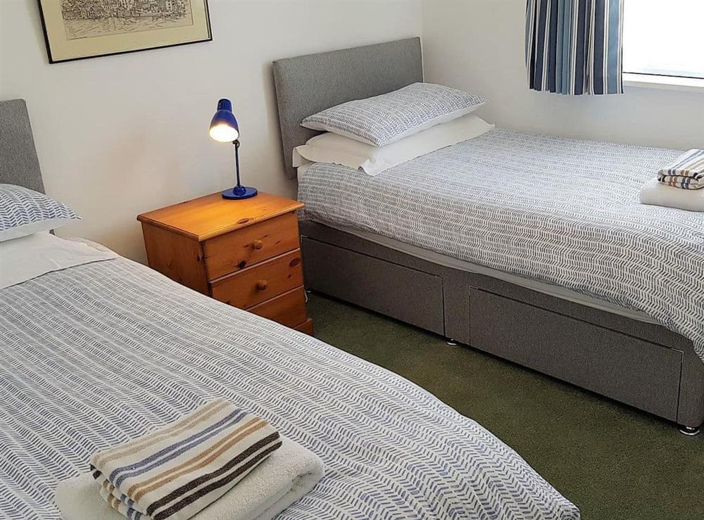 The cosy twin bedroom also has views of the river at Tarquins in Fowey, Cornwall