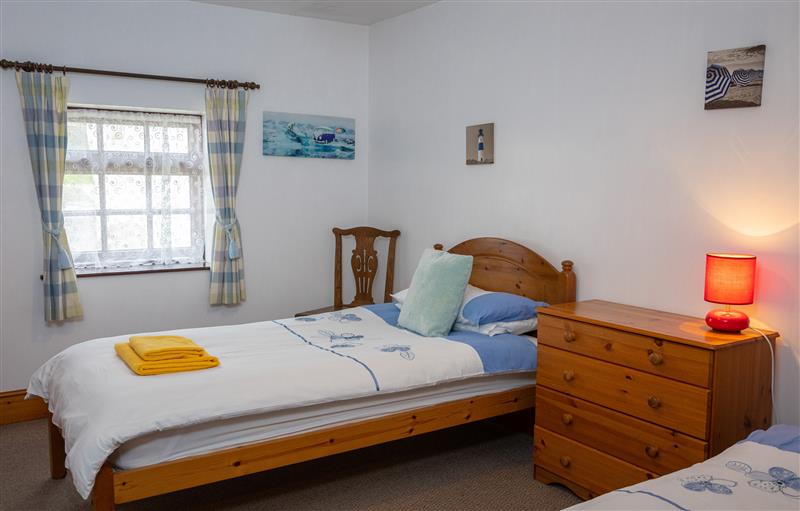One of the 2 bedrooms at Tarquol Cottage, Torrington