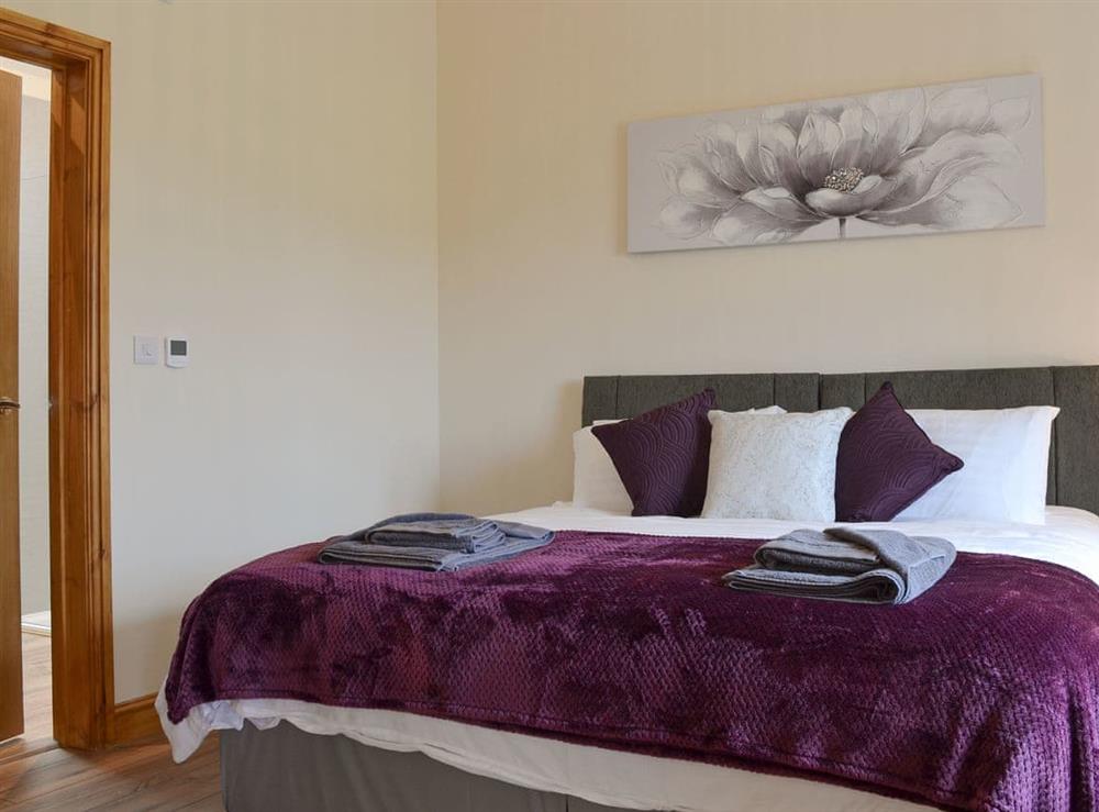 Comfortable double bedroom with superking sized bed at Taters Barn in Aikton, near Wigton, Cumbria