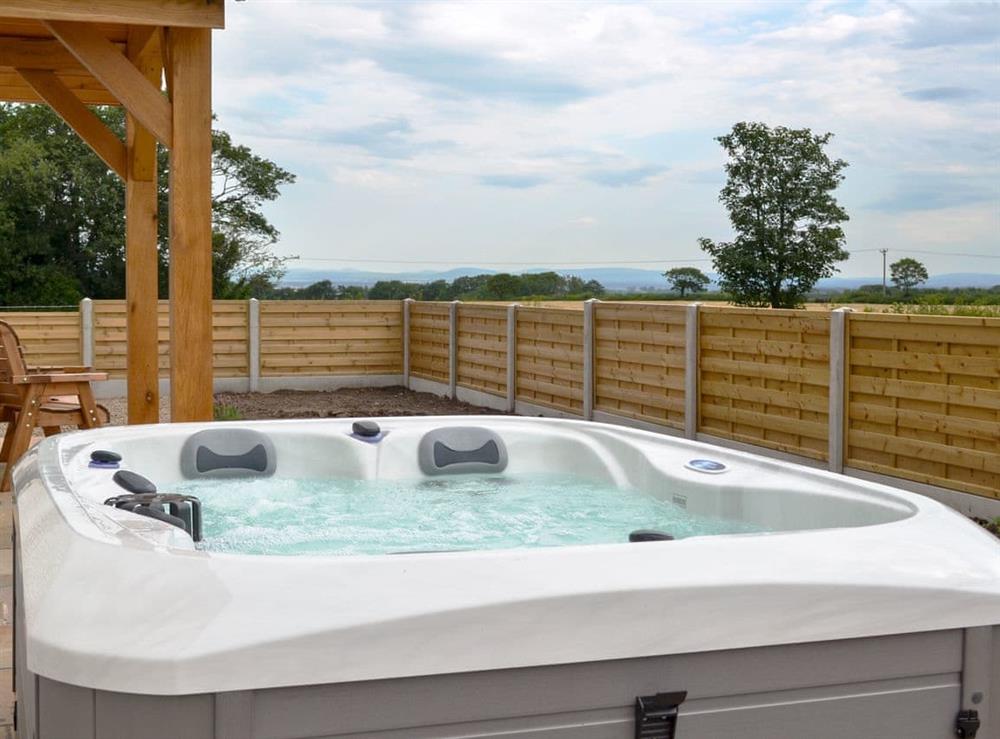 Relaxing hot tub (photo 2) at Taters Barn in Aikton, near Wigton, Cumbria