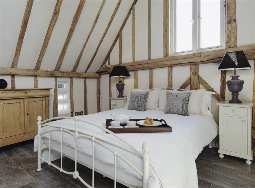 Beautifully presented gallery style double bedroom at Tatters Barn in Coggeshall, near Braintree, Essex