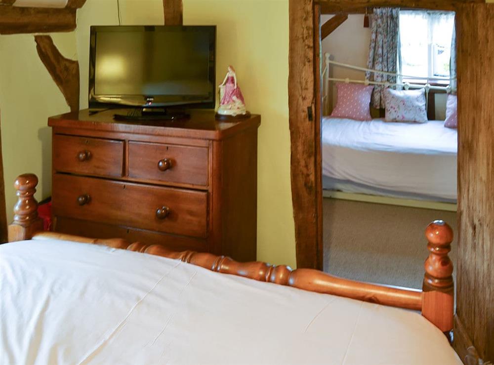 Bedroom with dressing area at Tattlepot Farmhouse in Pulham Market, near Diss, Norfolk