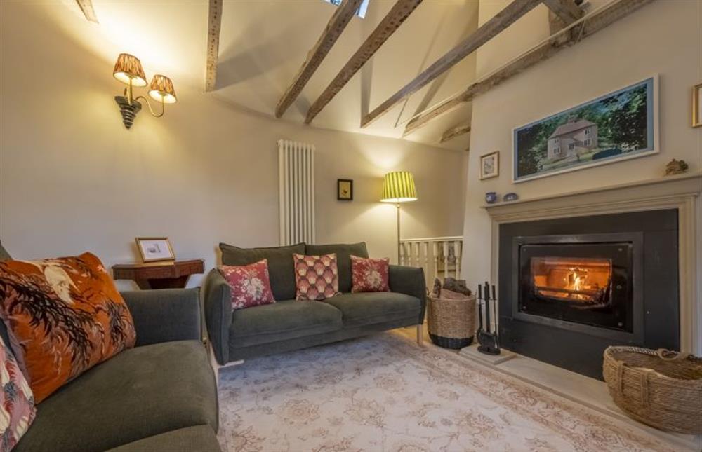 Cosy sitting room with wood burning stove