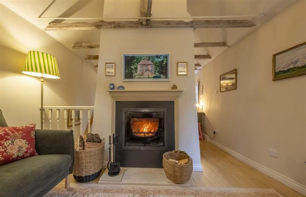 In the sitting room the wood burning stove sits beneath the ’picture frame’ Smart television